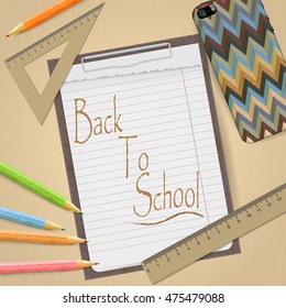 School and office supplies and empty clipboard isolated on light brown background