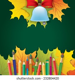 school stuff with autumn leaves on green background
