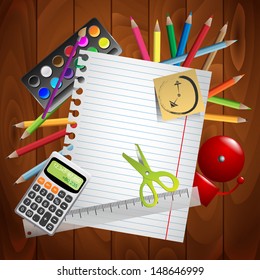 School stuff on wooden board with sticky note