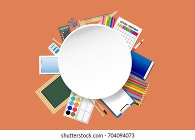 School supplies around the empty white circular plate ready for your text on the orange background