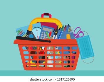 School Supplies In Orange Shopping Basket With Protective Medical Mask. COVID-19 Coronavirus Education Concept