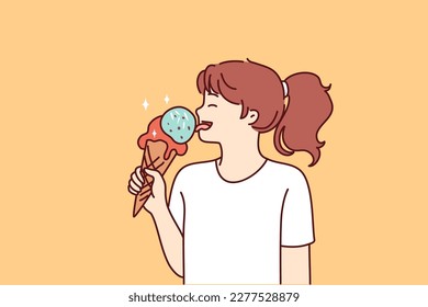 School-age girl licks large ice cream in waffle cone with fruit or caramel icing. Happy teenage girl eating ice cream enjoying summer dessert that helps to escape heat and refresh 