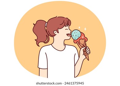 School-age girl licks large ice cream in waffle cone with fruit or caramel icing. Happy teenage girl eating ice cream enjoying summer dessert that helps to escape heat and refresh