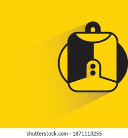 schoolbag with shadow on yellow background