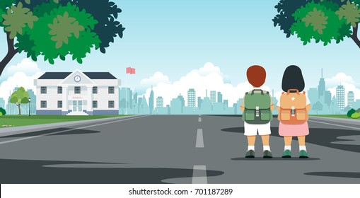 Schoolboy carrying student bag walks to school