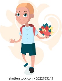 a schoolboy goes with a bouquet of leaves