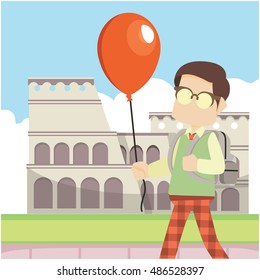 schoolboy holding balloon infront colloseum