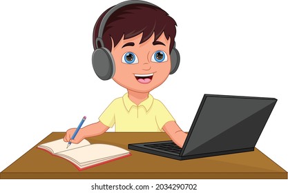 schoolboy studying in front of a laptop