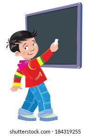 schoolboy writes chalk on a blackboard