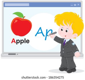 Schoolboy writing on the interactive whiteboard
