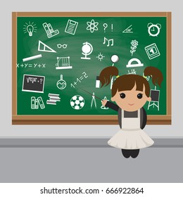 Schoolgirl in a classroom near the school board. Schoolgirl in school uniform 