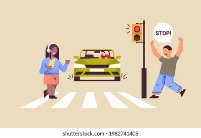 schoolgirl with smartphone and headphones crossing road on red traffic lights driver stops car immediately road safety