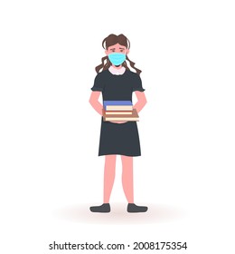 schoolgirl wearing face mask to prevent coronavirus pandemic social distancing covid-19 quarantine