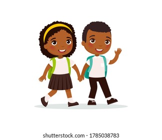 Schoolmates going to school flat vector illustration. Couple pupils in uniform holding hands isolated cartoon characters. Happy elementary dark skin school students with rucksack back to school 