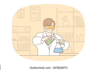 Science, chemistry, experiment concept. Young smiling boy scholar medical lab worker making chemical reaction in laboratory. Scientific test academic research, school experiments 