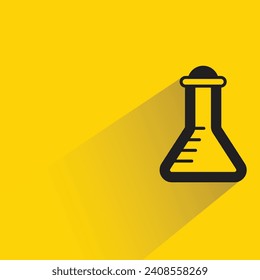 science flask with shadow on yellow background