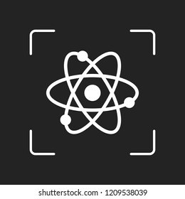 scientific atom symbol, simple icon. White object in camera autofocus on dark background