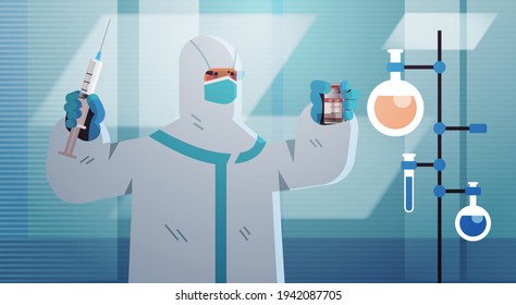 scientist developing coronavirus vaccine in lab researcher holding syringe and vial vaccine development