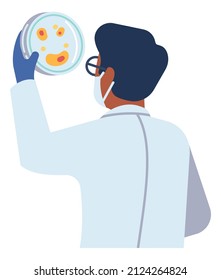 Scientist holding petri dish. Man in laboratory coat looking at bacterial colony