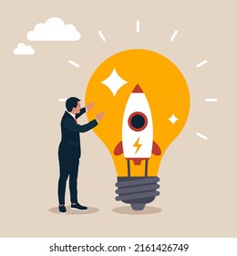 Scientist start up company owner standing with rocket inside lightbulb idea. Setting up new business, entrepreneurship,  motivation to create new business idea and make it success concept.