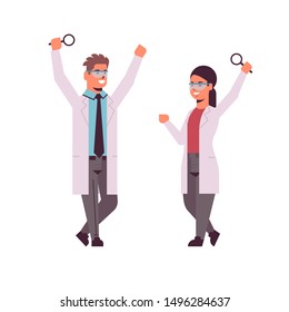 scientists couple raising hands with magnifying glass man woman researchers in uniform making experiment analysis in laboratory research science chemical concept full length flat