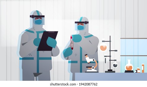 scientists developing vaccine to fight against coronavirus researchers in protective suits working in medical lab