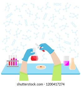 Scientist's hands reseaching substance with flasks