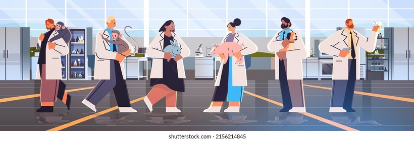 scientists or veterinary workers doing experiments in lab with experimental animals biological genetic engineering research