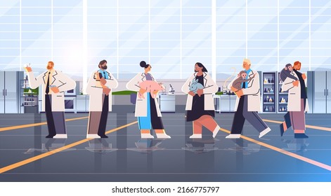 scientists or veterinary workers doing experiments in lab with experimental animals biological genetic engineering research