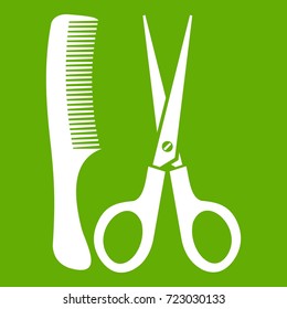 Scissors and comb icon white isolated on green background. Vector illustration