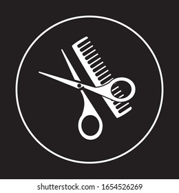 Scissors and comb on a white background