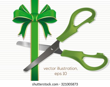 Scissors cut the green ribbon with a bow.