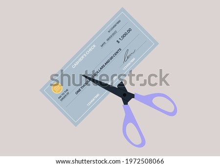 Scissors cutting a paper bank check, a money transfer operation canceling, an economic crisis concept