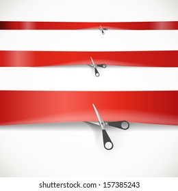 Scissors cutting the red advertising ribbon