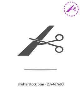 Scissors cutting ribbon