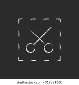 Scissors with dotted lines hand drawn in chalk on a blackboard vector white icon isolated on a black background.