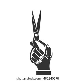 Scissors holding in hand, black icon isolated on white background. Vector illustration flat design.