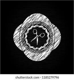 scissors icon drawn on a blackboard