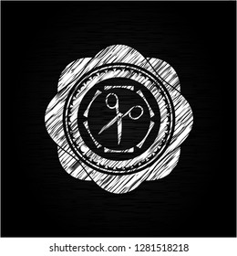 scissors icon drawn on a chalkboard