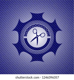 scissors icon inside badge with denim background