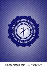 scissors icon inside badge with denim background