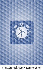 scissors icon inside blue badge with geometric background.