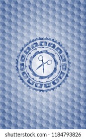 scissors icon inside blue polygonal emblem.