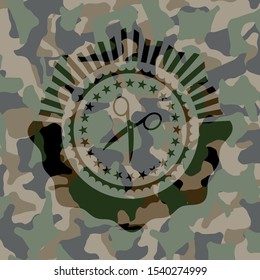 scissors icon inside camouflage texture