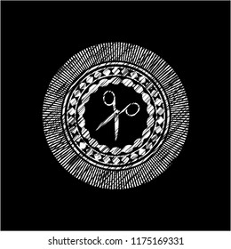 scissors icon inside chalk emblem written on a blackboard
