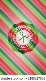 scissors icon inside christmas badge.