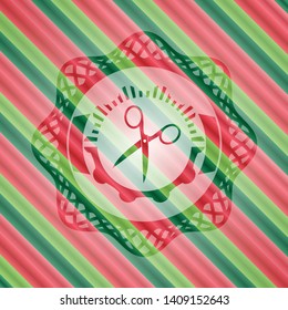 scissors icon inside christmas badge.