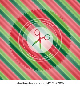 scissors icon inside christmas badge.