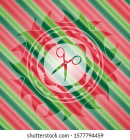 scissors icon inside christmas colors badge.