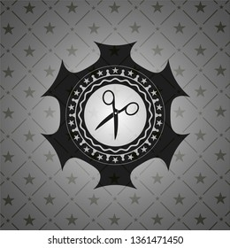 scissors icon inside dark emblem